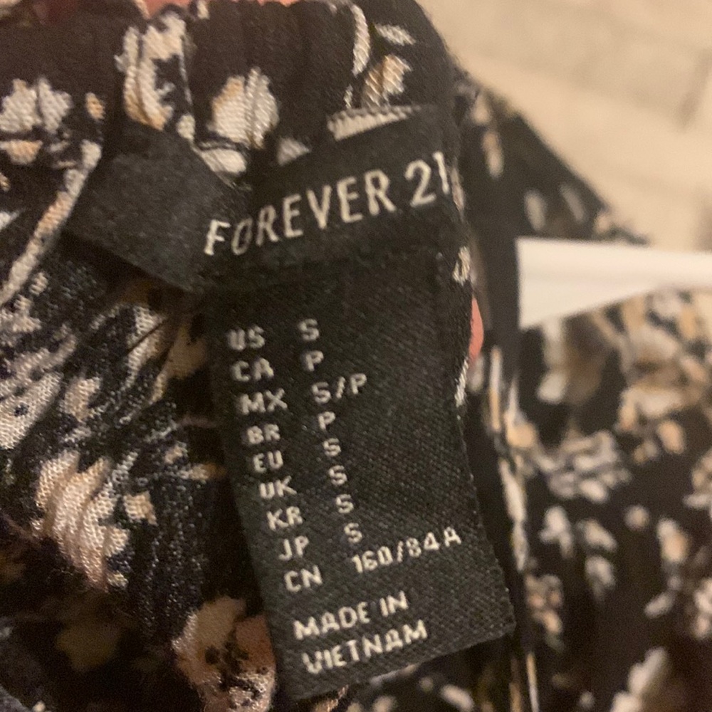 Super cute sundress black with light pink flower patern. Selling due to not worn